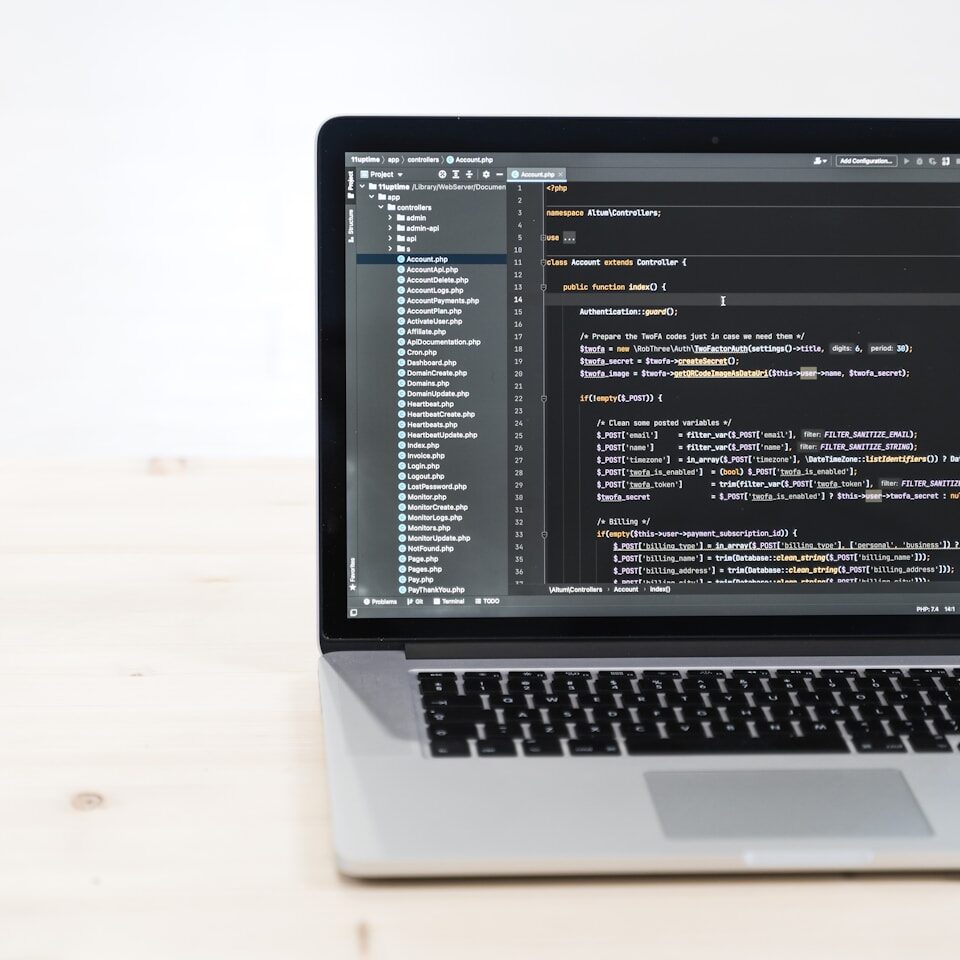 macbook pro on white table